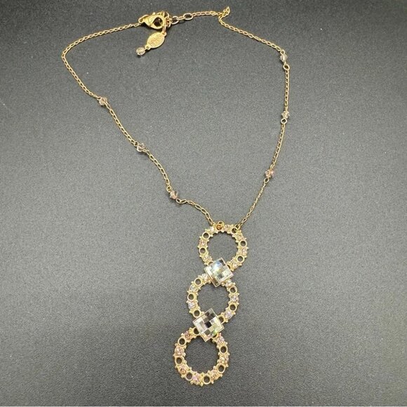 Belladonna Circular Crystal and Gold Tone Infinity Pendant Necklace - Picture 8 of 17